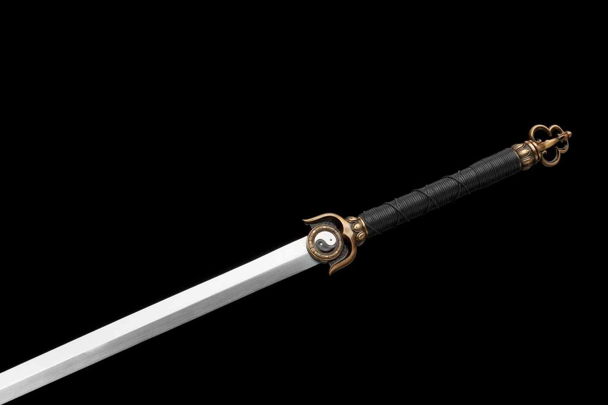 Polished Chenguang Jian blade beside the Yin-Yang guard and long black cord-wrapped handle
