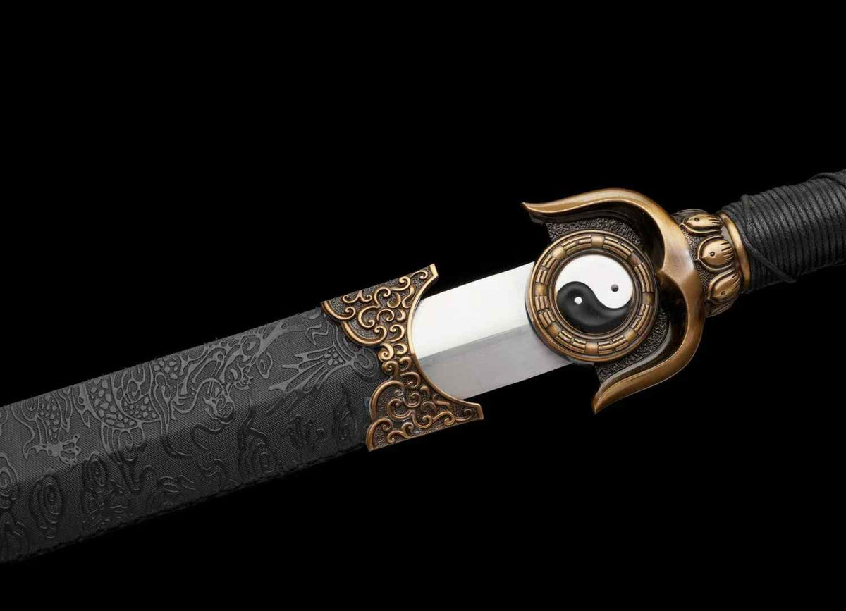 Chenguang Jian Yin-Yang guard and polished blade partially drawn from the black patterned scabbard