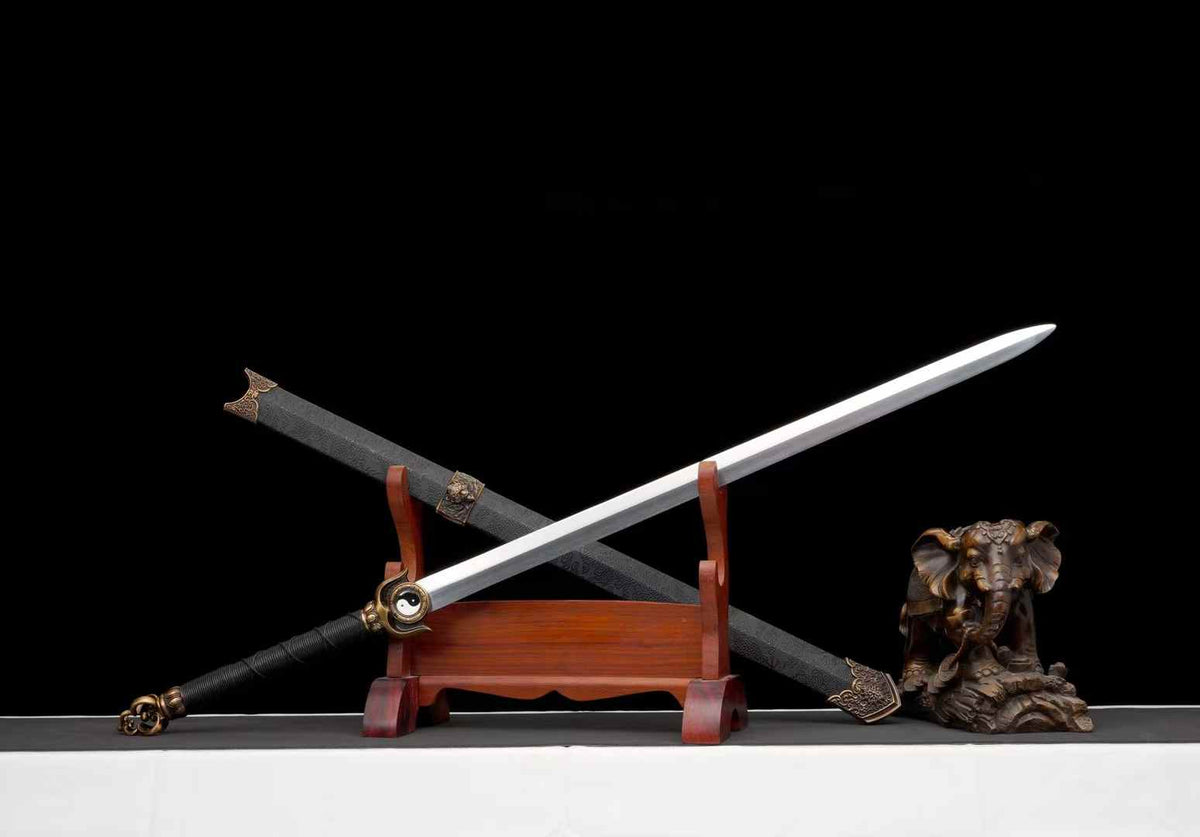 Reverse angled view of Chenguang Tai Chi Jian with its blade crossing the scabbard; display props not included
