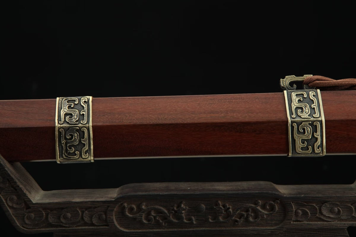 Reddish-brown wooden Hanwang Jian scabbard with carved brass bands and decorative brown cord