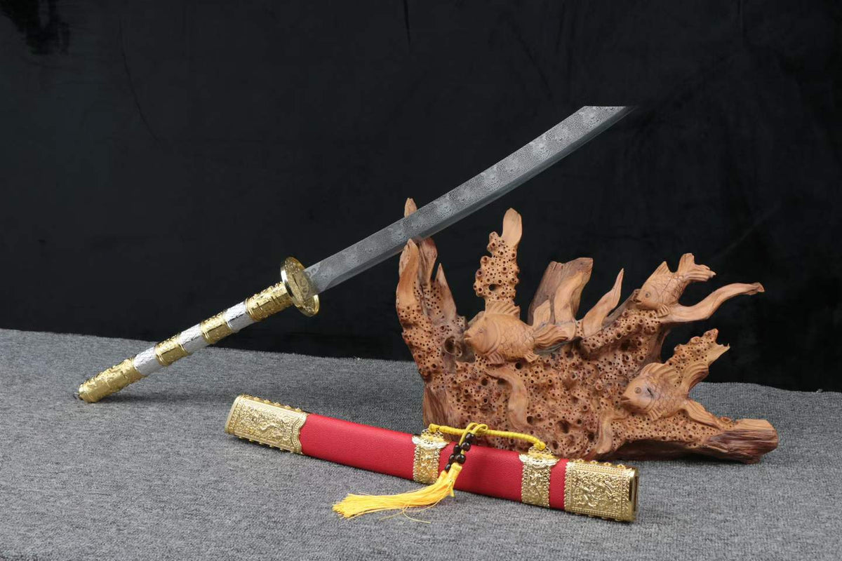 Leopard-pattern Kangxi Dao with a long ornate handle and red scabbard beside a decorative wood stand; stand not included