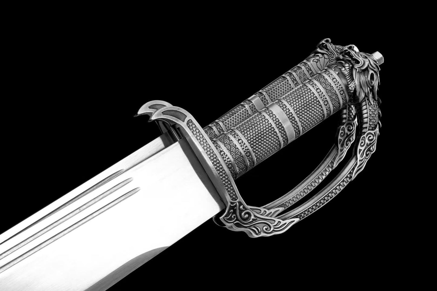 Twin silver dragon handles with decorative blade grooves