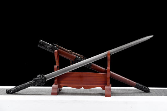 Reverse view of Black Dragon Jian with its blade crossing the matching wooden scabbard; display stand not included
