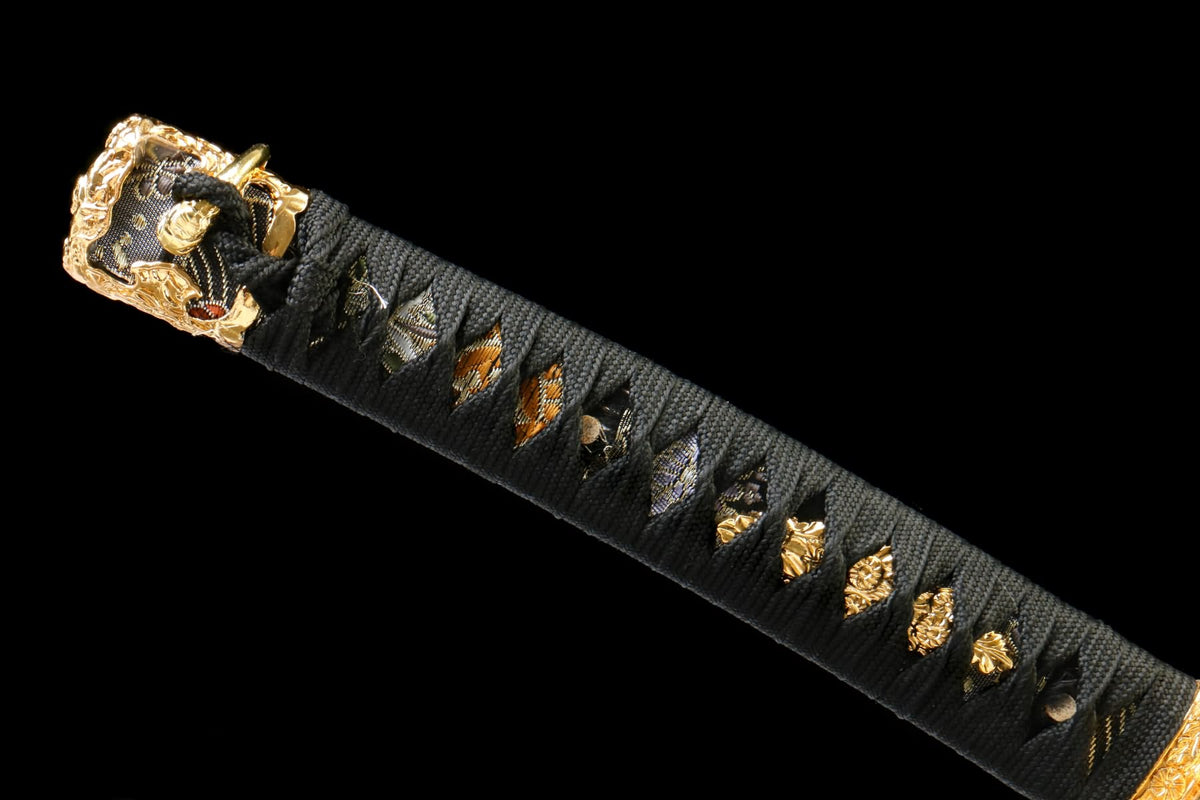 Black wrapped Tachi handle with diamond-shaped openings and gold-tone decorative fittings