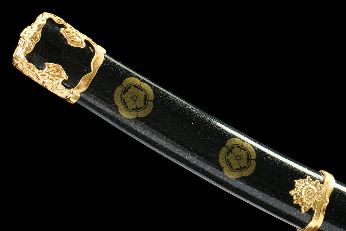 Black painted Tachi scabbard with gold-tone crest motifs and ornamental end fitting