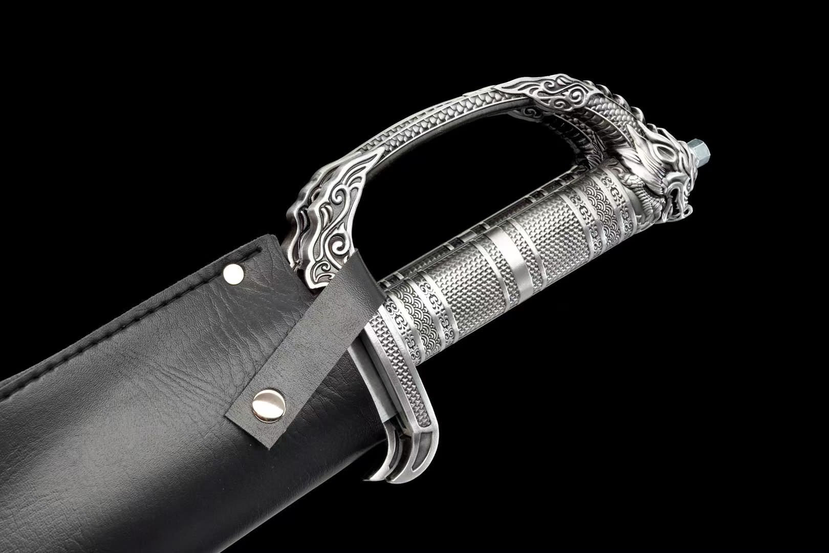 Butterfly sword handle beside black shared scabbard