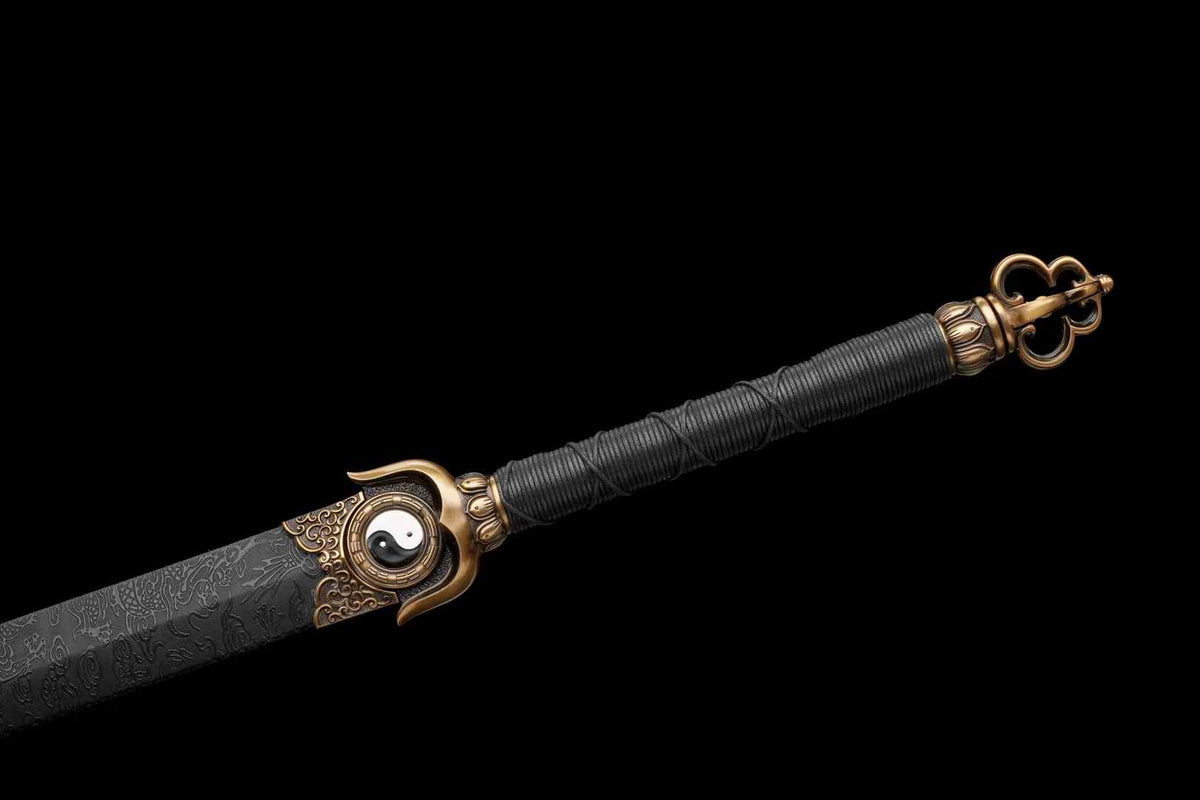 Black cord-wrapped Chenguang Jian handle with Yin-Yang guard, bronze-tone decoration and openwork pommel