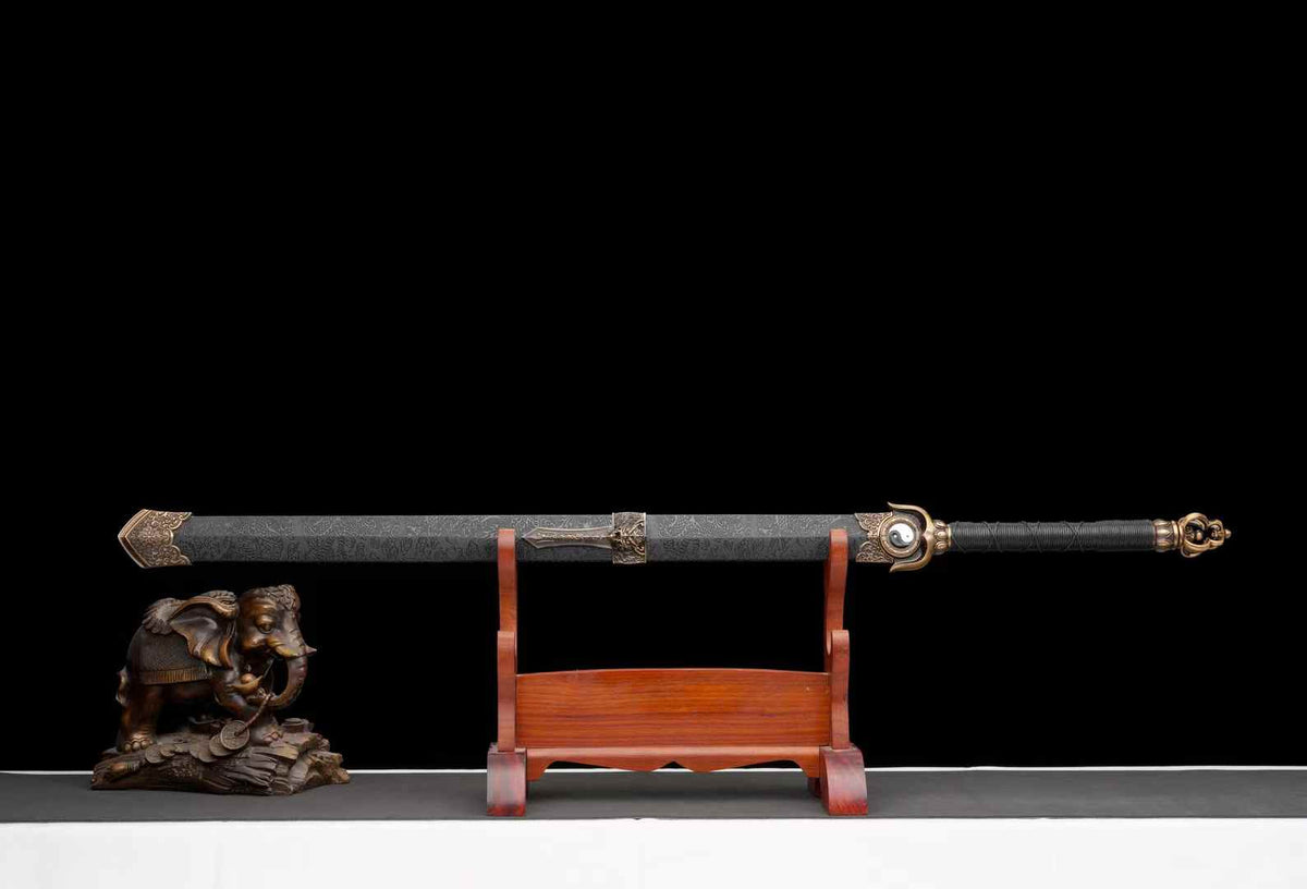 Chenguang Tai Chi Jian sheathed in a black patterned scabbard with bronze-tone decoration; display props not included