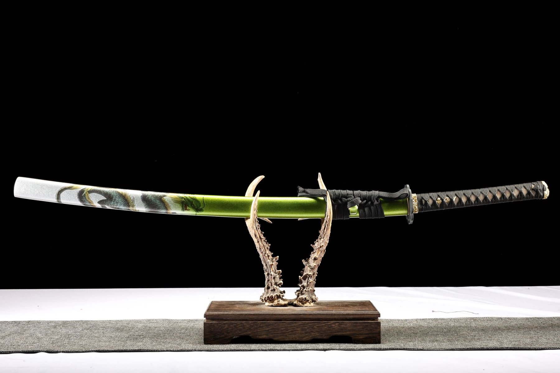 Green Dragon katana fully sheathed in green lacquered scabbard