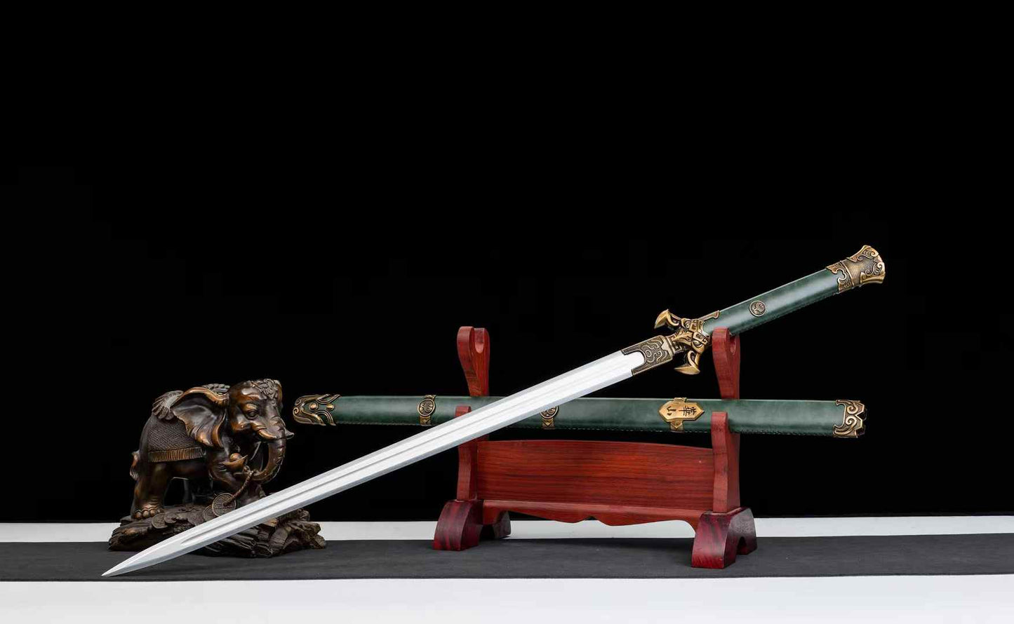 Unsharpened Huashan Jian displayed with dark green scabbard
