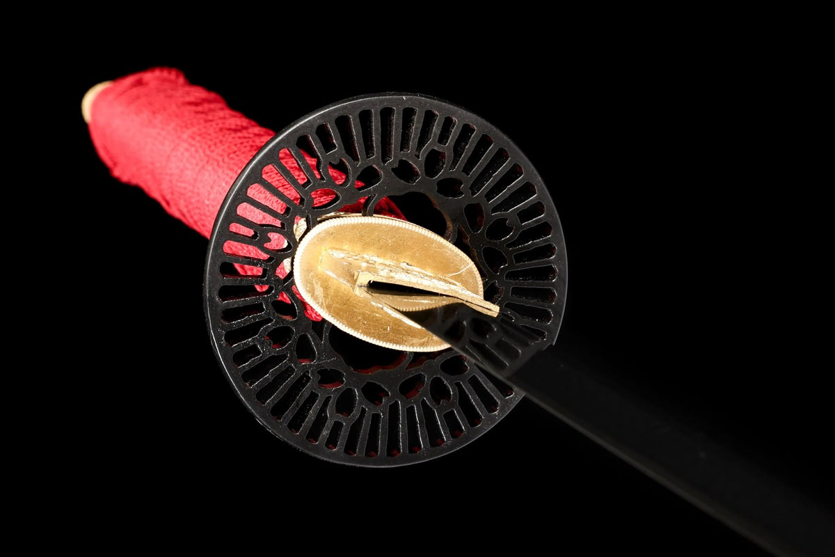Iron tsuba and copper seppa fitting detail
