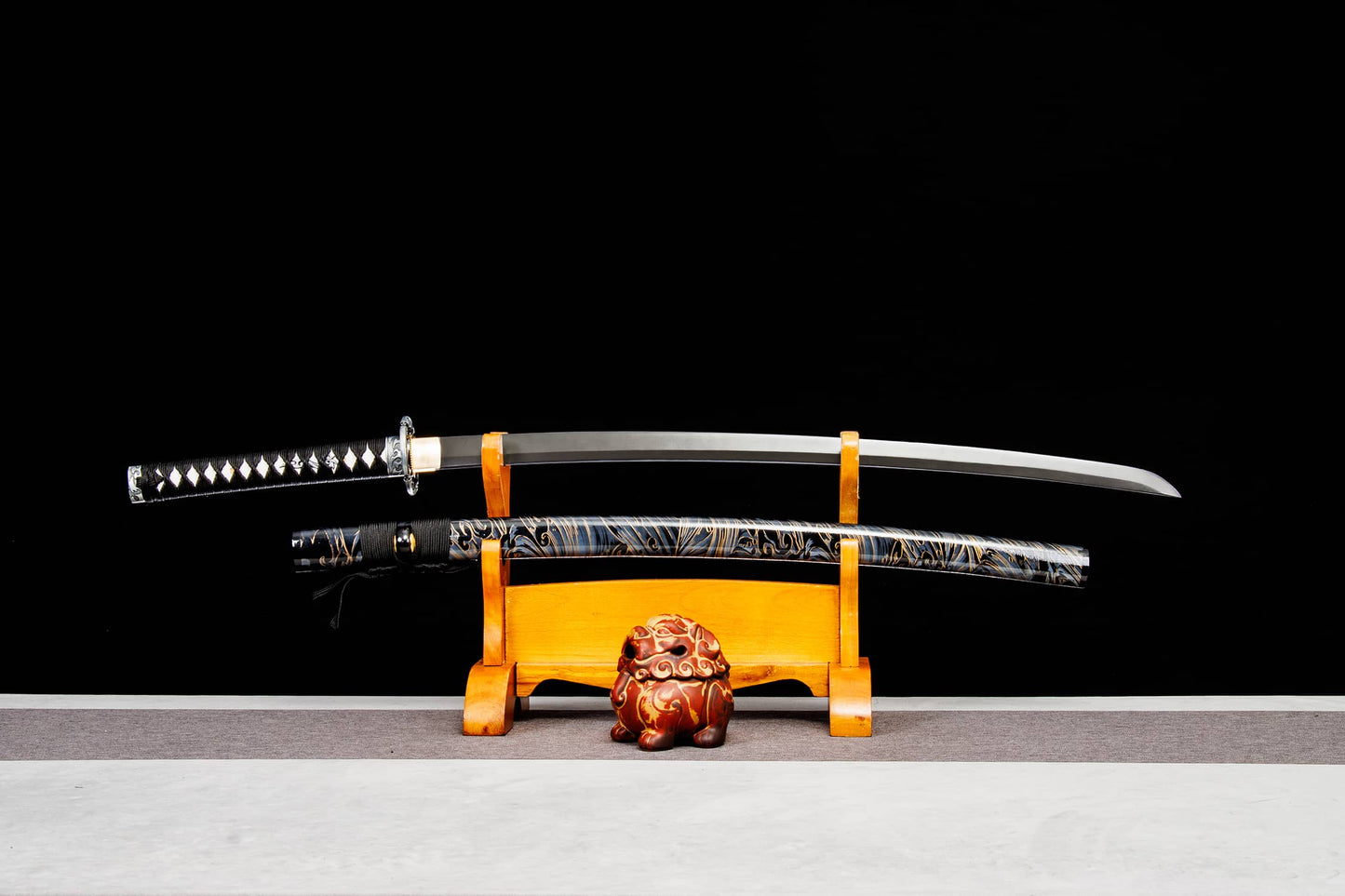 katana sword with lacquered wood saya on display stand