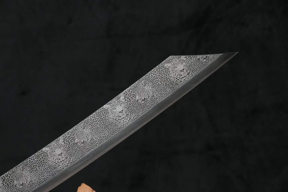 Angled Kangxi Dao blade tip with decorative leopard-pattern surface