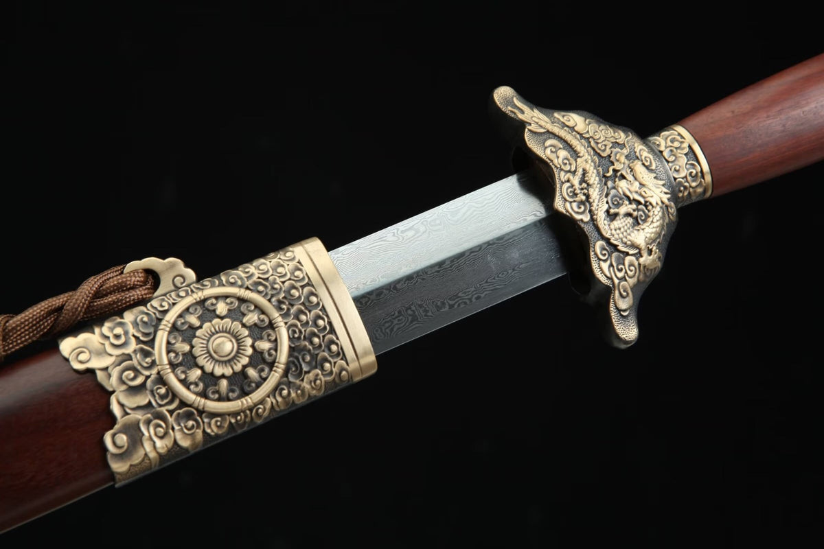 Longyao Jian partially drawn from its scabbard, showing the blade pattern, dragon guard and ornate brass throat fitting