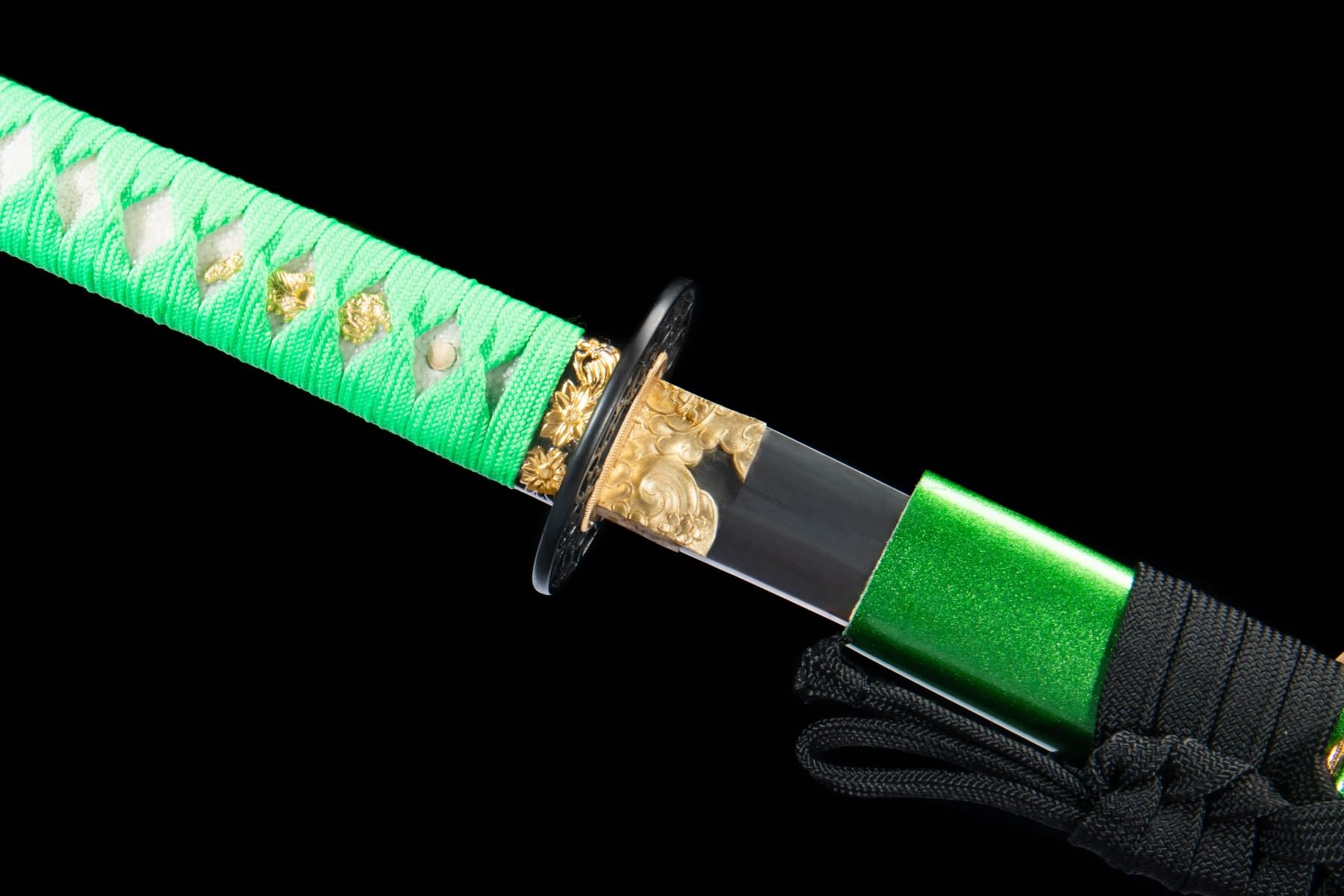 Copper habaki and seppa beside green wrapped katana handle