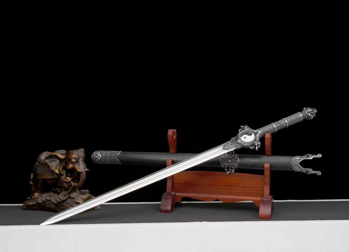Angled view of the Qingfeng Jian blade and matching scabbard; wooden stand and decorative statue not included