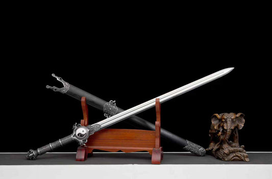 Reverse angled view of Qingfeng Jian with its blade across the dark scabbard; display props not included