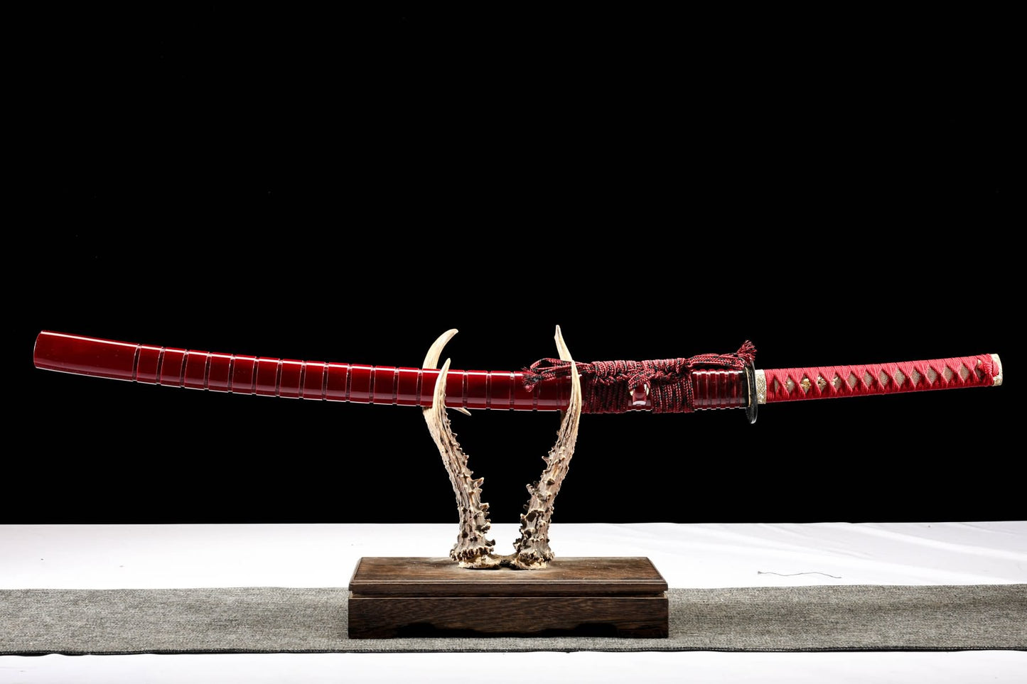 Sheathed katana with red piano-lacquer wood saya