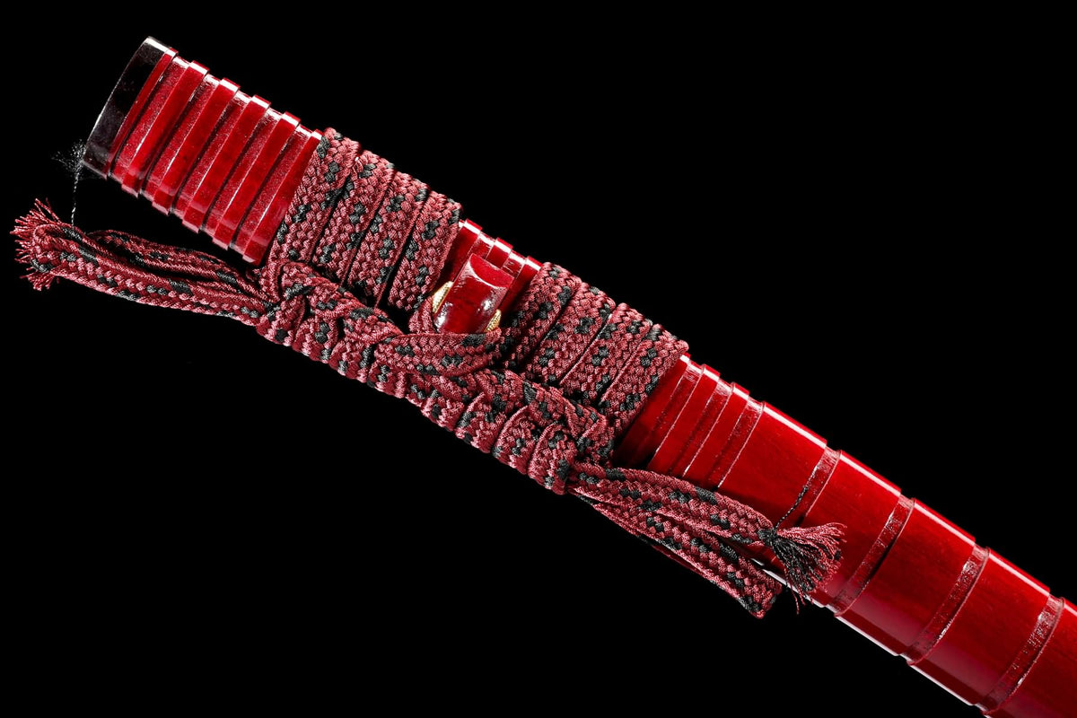 Red lacquer saya with patterned sageo cord knot