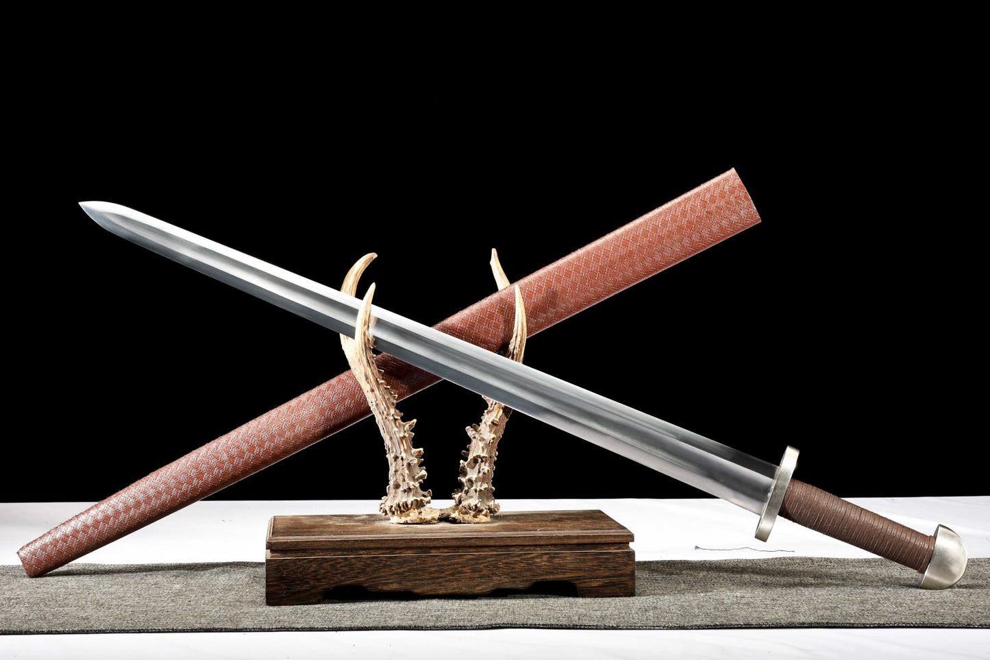 Viking sword and brown scabbard in diagonal display