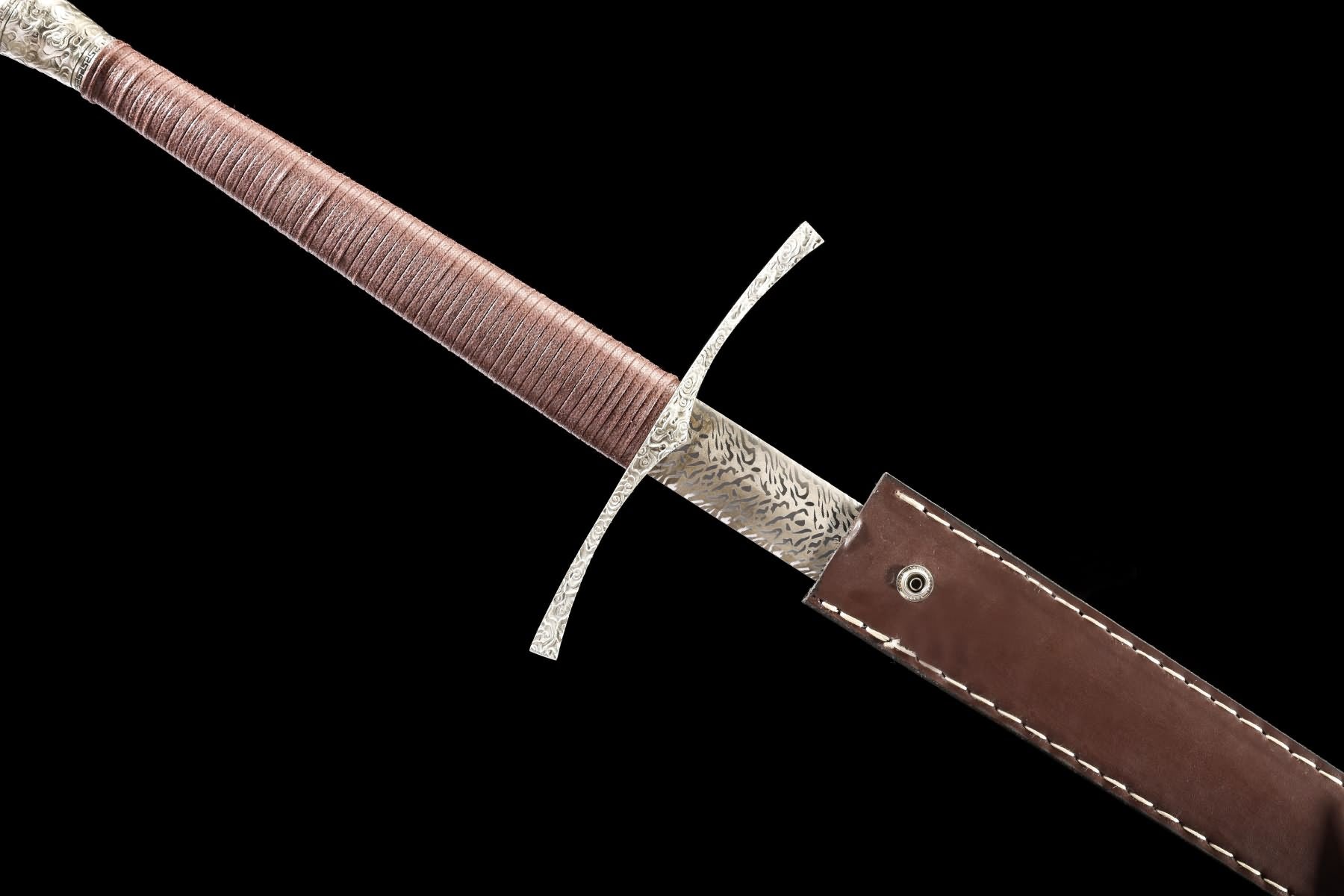 Xiangyun longsword partially inserted into handmade brown leather sheath