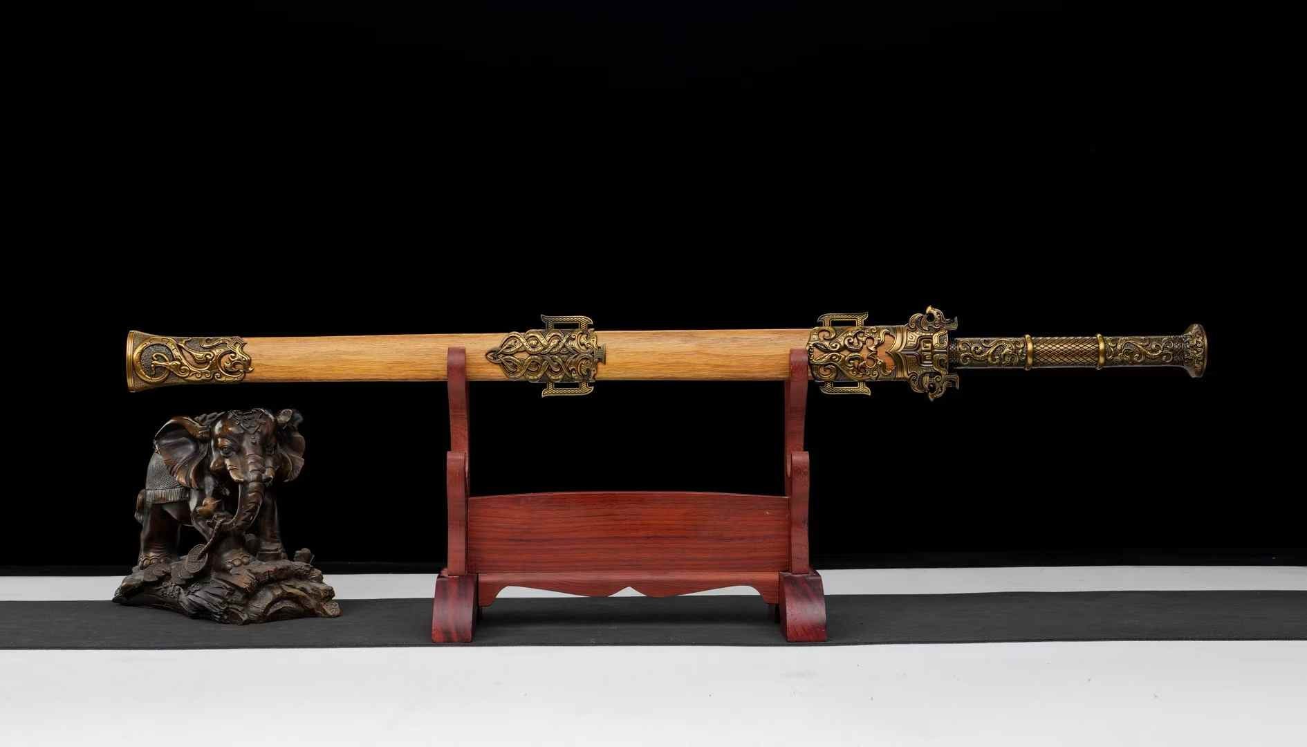 Fully sheathed Yue King Jian with carved-style alloy fittings and natural wood grain